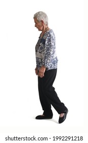 Full Portrait Of A Senior Woman Side View, Walking On White Background