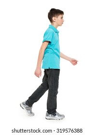 Full portrait of walking teen boy in blue t-shirt casuals  isolated on white background. 