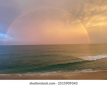 Full rainbow over ocean horizon - Powered by Shutterstock