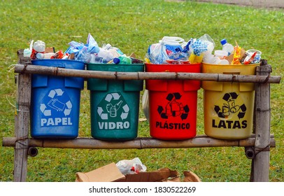 Full recyclable garbage cans used inappropriately. Separation and color criteria.