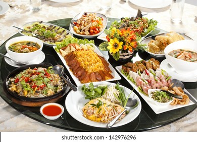 Full rounded table of Chinese Thai food, duck and sauce