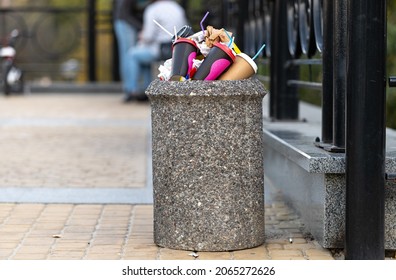 Full Rubbish Bin. Trash Waste In A Stone Park Basket In The Shape Of A Bucket. Copy Space