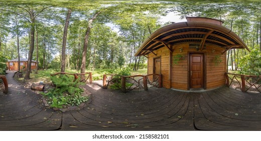 Full seamless panorama 360 degrees of beautiful log house and garden with patio