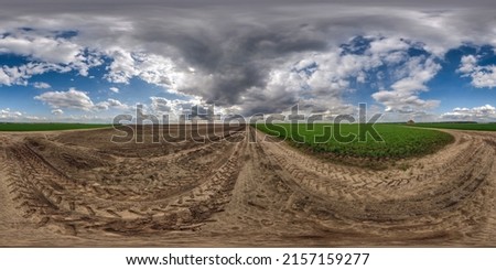 full seamless spherical 360 hdri panorama view on no traffic gravel road among fields in spring day with beautiful clouds in equirectangular projection, ready for VR AR