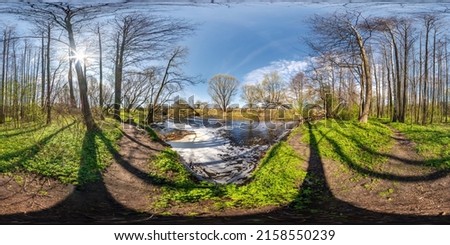 full seamless spherical 360 hdri panorama view in beautiful spring forest or park with bright sun shining through the trees near fast river with water foam in equirectangular projection, VR AR content