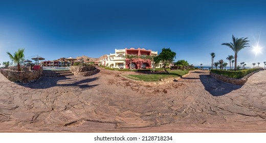 full seamless spherical hdr 360 panorama view near of an two-story building  with landscaped area with palm trees in equirectangular projection, ready for VR AR virtual reality