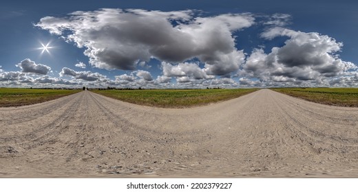 full seamless spherical hdri 360 panorama view on no traffic gravel road among fields with overcast sky and white clouds in equirectangular projection,can be used as replacement for sky in panoramas