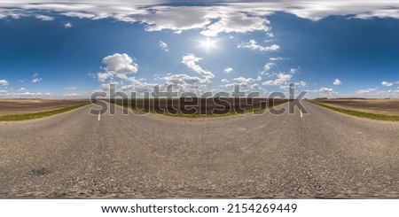 full seamless spherical hdri 360 panorama view on no traffic asphalt road among fields in summer day with clear sky and awesome clouds in equirectangular projection, ready for VR AR virtual reality
