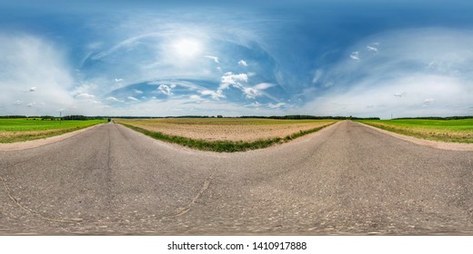 full seamless spherical hdri panorama 360 degrees angle view on asphalt road among fields in summer day with awesome clouds in equirectangular projection, ready for VR AR virtual reality content