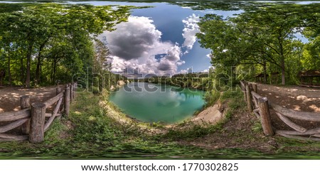 full seamless spherical hdri panorama 360 degrees angle view on limestone coast of huge green lake or river near forest in summer day with beautiful clouds in equirectangular projection, VR content