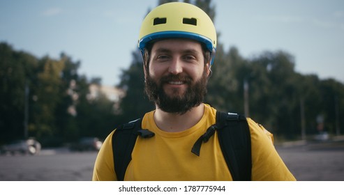 Full Shot Of A Bike Messenger Looking At Camera