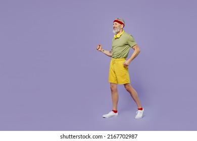 Full Size Body Length Active Fun Fitness Trainer Elderly Gray-haired Bearded Man 50s Years Old In Headband Khaki T-shirt Pace Go Stroll Isolated On Plain Pastel Light Purple Background Studio Portrait