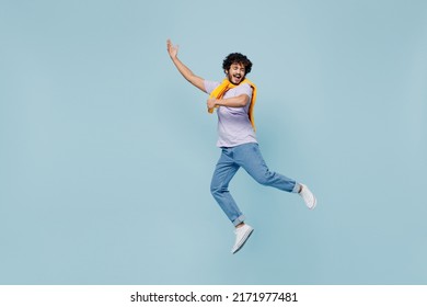 Full size body length amazing happy young bearded Indian man 20s years old wears white t-shirt singing song dreaming like playing guitar isolated on plain pastel light blue background studio portrait - Shutterstock ID 2171977481
