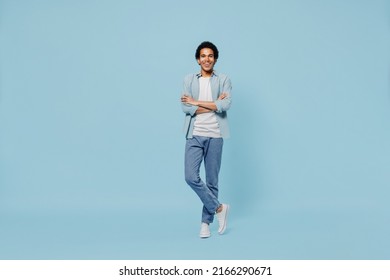 Full Size Body Length Cheerful Fascinating Happy Fun Blithesome Young Black Curly Man 20s Years Old Wears White Shirt Hold Hands Crossed Isolated On Plain Pastel Light Blue Background Studio Portrait