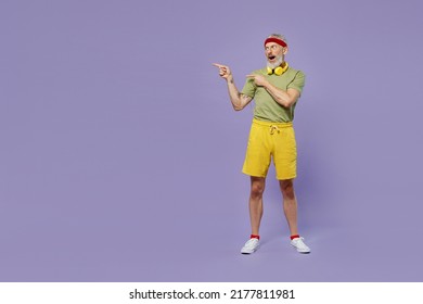 Full Size Body Length Elderly Gray-haired Bearded Man 60s Years Old In Headband Khaki T-shirt Point On Workspace Area Copy Space Mock Up Isolated Plain Pastel Light Purple Background Studio Portrait