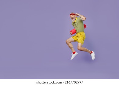 Full size body length fun sporty elderly gray-haired bearded man 50s years old in headband khaki t-shirt run go in jump hold yoga mat isolated on plain pastel light purple background studio portrait - Powered by Shutterstock