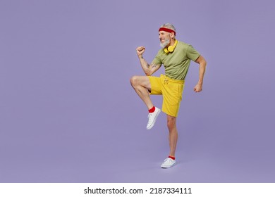 Full Size Body Length Fun Elderly Gray-haired Bearded Man 40s Years Old In Headband Khaki T-shirt Tilt Body To Sides With Hand Stretch Isolated On Plain Pastel Light Purple Background Studio Portrait