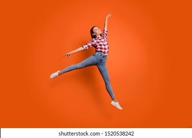 Full size body length photo of pretty glad attractive light gorgeous lady jumping up showing graceful movements isolated bright color background