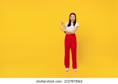 Full Size Body Length Promoter Young Woman Of Asian Ethnicity 20s Years Old In Casual Clothes Point Aside On Workspace Area Copy Space Mock Up Isolated On Plain Yellow Background Studio Portrait