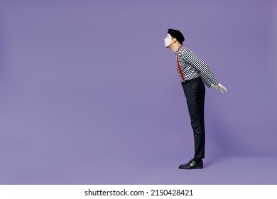 Full Size Body Length Side View Profile Fun Young Mime Man With White Face Mask Wears Striped Shirt Beret Keep Eyes Closed Kiss Someone Isolated On Plain Pastel Light Violet Background Studio Portrait