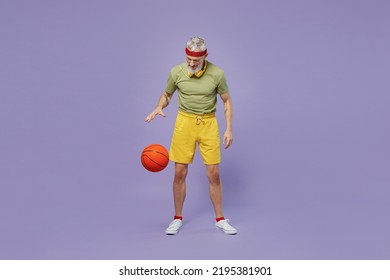 Full Size Body Length Sporty Excited Happy Elderly Gray-haired Bearded Man 40s Years Old In Headband Khaki T-shirt Play Basketball Act Isolated On Plain Pastel Light Purple Background Studio Portrait