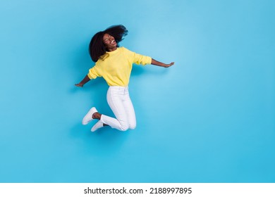 Full Size Body Photo Of Young Crazy Excited Lady Jump Happy New Summer Season Playlist Spotify Isolated On Blue Color Background