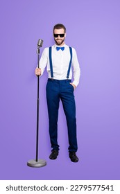 Full size full body portrait of cheerful elegant singer with bristle in blue outfit white shirt holding hand in pocket, having mic, isolated over grey background - Shutterstock ID 2279577541
