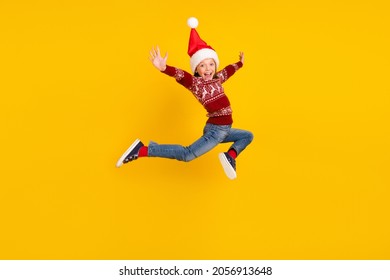 Full size photo of amazed excited small girl jump up raise hands season sale isolated on yellow color background - Powered by Shutterstock