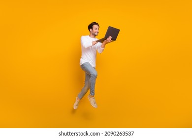 Full size photo of boss brunet young guy jump wear shirt jeans sneakers isolated on yellow background - Shutterstock ID 2090263537