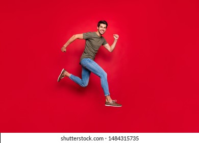 Full Size Photo Of Champion Guy Jumping High Came First To Finish Wear Casual Outfit Isolated On Red Background