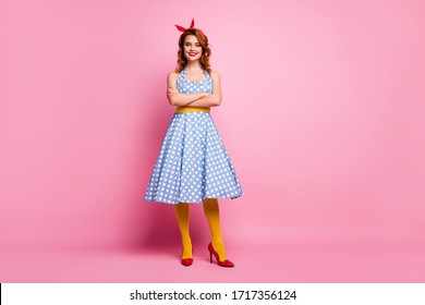 Full size photo of cheerful sweet bright shine lady cross hands enjoy summer holidays wear polka-dot outfit yellow tights isolated over pink color background