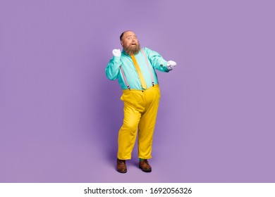 Full Size Photo Of Funky Positive Crazy Overweight Man Dance On Retro Party Concert Wear White Gloves Turquoise Footwear Isolated Over Violet Color Background