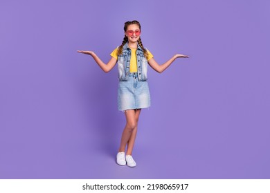 Full Size Photo Of Funny School Blond Girl Hold Promo Wear Eyewear T-shirt Jeans Vest Skirt Shoes Isolated On Violet Color Background