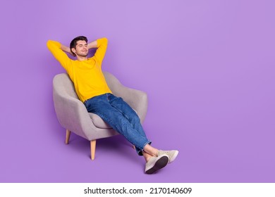 Full size photo of good mood calm peaceful man sit comfy armchair have a nap isolated on violet color background