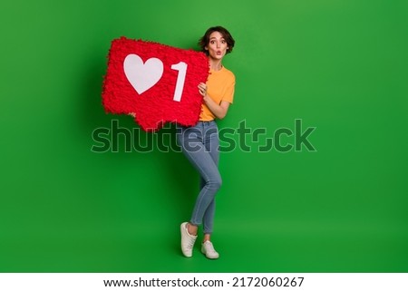 Full size photo of impressed pretty lady pouted lips arms hold large like collage isolated on green color background