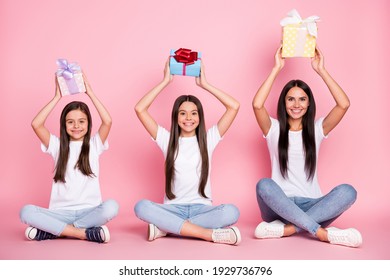 Full Size Photo Of Impressed Three Woman Mom Daughters Sit With Gifts Wear White Cloth Isolated On Pink Background