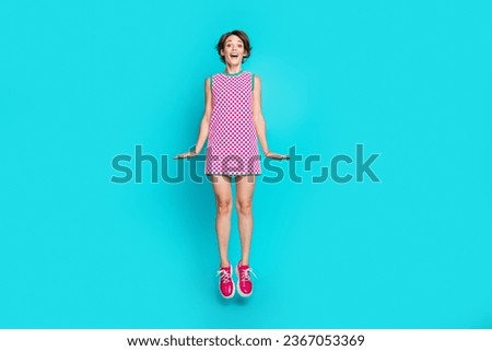 Full size photo of jump air trampoline crazy girl gorgeous model posing advert shopping marketing placard isolated on blue color background