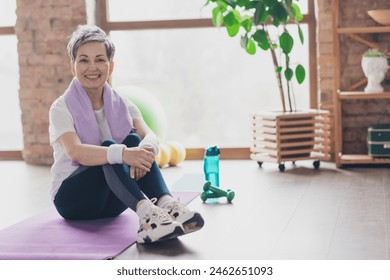 Full size photo of nice retired woman sit mat exercises sportswear sport healthy lifestyle workout modern apartment home living room - Powered by Shutterstock