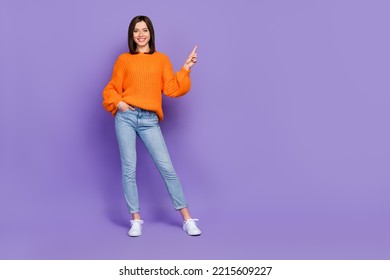 Full size photo of positive gorgeous girl indicate finger empty space isolated on violet color background - Shutterstock ID 2215609227