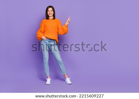 Full size photo of positive gorgeous girl indicate finger empty space isolated on violet color background Imagine de stoc © 