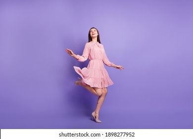 Full size photo of pretty person look empty space dance wear retro outfit isolated on purple color background - Shutterstock ID 1898277952
