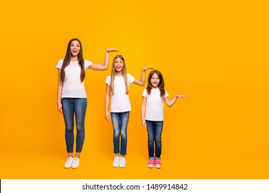 Full size photo of three sister ladies not believe such quick growing up wear casual outfit isolated yellow background