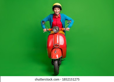 Full Size Photo Of Young Beautiful Happy Smiling Excited Girl Wear Yellow Helmet Ride Red Moped Isolated On Green Color Background