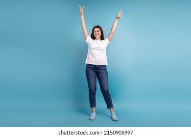 Full size photo of young charming girl have fun show fingers peace v-symbol isolated over blue color background - Shutterstock ID 2150905997