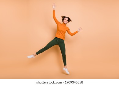 Full size photo of young funky funny happy positive smiling cheerful girl jumping isolated on pastel color background