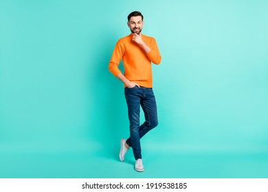 Full Size Photo Of Young Handsome Good Looking Smiling Flirty Man Hold Hand Chin Isolated On Teal Color Background