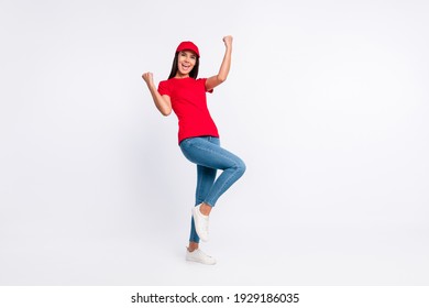 Full size photo of young happy excited crazy delivery girl raise fists in victory success isolated on grey color background