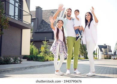 Full Size Photo Of Young Happy Positive Smiling Family Waving Hands Greeting Saying Hello Walk Outside Outdoors