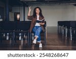 Full size photo of young lady audience chair notepad raise arm ask workshop conference room business center indoors