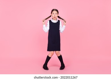 Full Size Photo Of Young School Girl Amazed Shocked Surprised Shy Isolated Over Pink Color Background